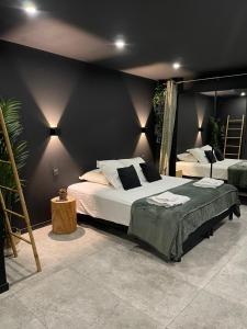 Appartements Spa & Love Exotic - Balneo - Sauna - Parking : photos des chambres