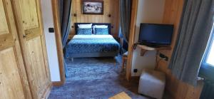 Hotels Hotel-Chalet Les Ecureuils Jardin, Piscine, Sauna : photos des chambres