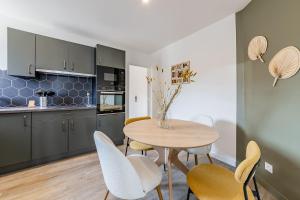 Appartements L'Hermes - Charmant appartement moderne et cosy : photos des chambres