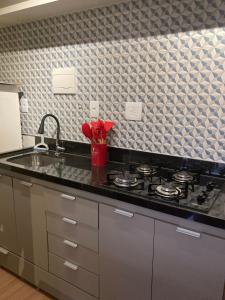 Flat Condomínio Garden Park by CentoEdez