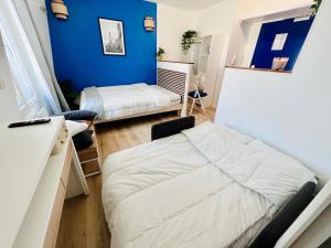 Appartements La vie en bleu - Studio proche de Paris : photos des chambres