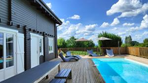 Maisons de vacances Villa du Fauquie The incomparable charm of a wooden house : photos des chambres