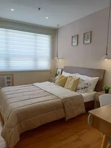 Lovely 2BR Seawind condo with pool view balcony & Fiber Internet - Dasag