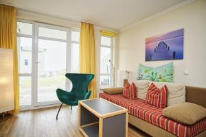 Terrasse, gratis Nutzung vom AHOI Erlebnisbad und Sauna in Sellin - Meeresblick FeWo 19