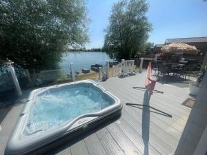 Indulgence lakeside lodge i1 with hot tub, private fishing peg situated at Tattershall Lakes Country Park