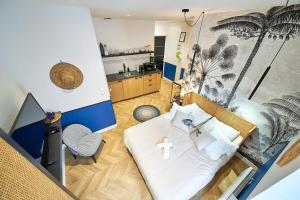 Appartements La Palmeraie-joli studio-Metro Valmy-Vaise : photos des chambres