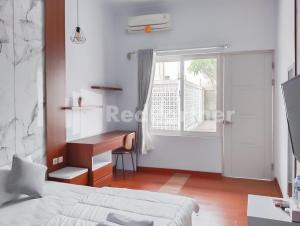 Khayrizsan Guest House Mitra RedDoorz