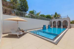 Bellevue Palace by StayVista - Lavish abode with a pool, Landscaped lawn, Gazebo & Adventure activities