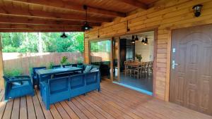 Nad Kalwą - Mazury całoroczny dom do wynajęcia z widokiem na jezioro - pomost - łódka - rower wodny