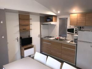 Appartements Mobil home recent de 3 chambres dans un Camping 4* : photos des chambres