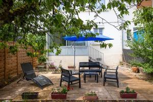 Appartements Le coquet chez Maguy Maison de ville avec jardin : photos des chambres