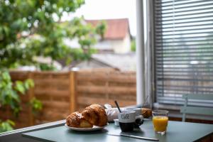 Appartements Le coquet chez Maguy Maison de ville avec jardin : photos des chambres