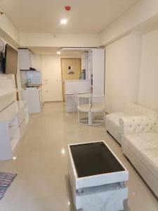 RoomQu at Apartment Amazana Serpong Residence