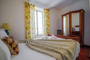 Maisons de vacances Le Pech Merle YourHostHelper : photos des chambres