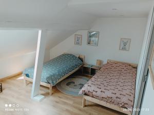 Appartements Spacieux appartement en duplex : photos des chambres