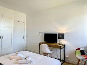 Appartements Sur la plage YourHostHelper : photos des chambres