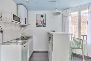 Appartements Le Bleu des Bains - Charmant studio proche plage : photos des chambres