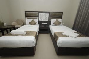 Grand Courtyard Business Hotel, Saligramam