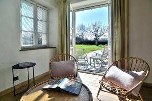 Maisons de vacances Le Verger - Charmante maison avec jardin : photos des chambres