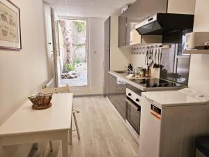 Appartements Grand T2 tout equipe centre ville avec cour : photos des chambres