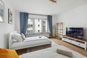 Große 80qm 3 Zimmer Wohnung, nahe Messe & Klinikum, 2x 55" Smart TV, Netflix, Keyless