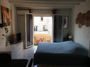 Appartements Studio tout confort centre ville - Balcon, Clim, TV, Wifi : photos des chambres