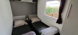 Complexes hoteliers Grand Mobil home 10 places avec 4 chambres SIBLU proche Ocean : photos des chambres