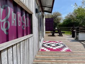 Purple CargoPod at Lee Wick Farm Cottages & Glamping