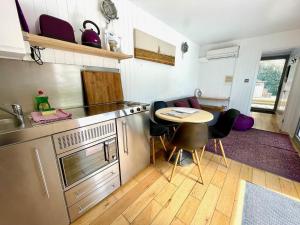 Purple CargoPod at Lee Wick Farm Cottages & Glamping