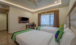 Treebo Aaravi Residency, 800 Mtrs From Promenade Beach