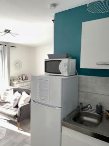 Appartements Les Lauriers. Studio cosy avec piscine : photos des chambres