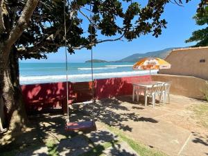 Casa aconchegante pé na areia c 5 quartos.