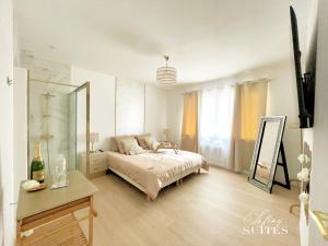 Appartements Blooming Suites : photos des chambres