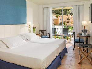 Double or Twin Room with Side Sea View room in Boutique Hotel H10 Blue Mar - Adults Only