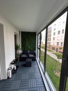 Appartements Appartement avec son jardin d’hiver : Appartement 1 Chambre