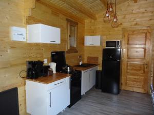 Chalets Un chalet en bois dans un ecrin de verdure : photos des chambres