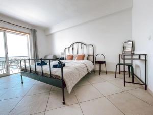 Peniche master bedroom with sea view balcony, private bathroom, shared kitchen, swimming pool, surfing resort
