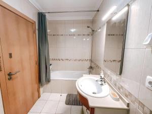 Peniche master bedroom with sea view balcony, private bathroom, shared kitchen, swimming pool, surfing resort