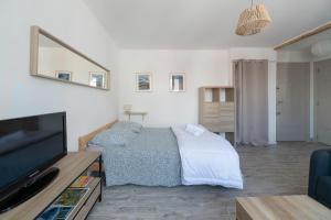 Appartements Le Jean Bapt- Charmant studio a proximite du plan d’eau : photos des chambres