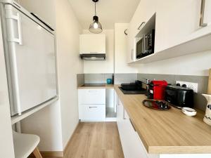 Appartements T2 refait a neuf – A 2 pas du bourg et des plages : photos des chambres