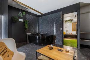 Appartements L’Eden, appartement privatif avec balneo : photos des chambres