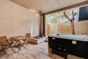 Appartements Aristide Bruant avec spa privatif : photos des chambres