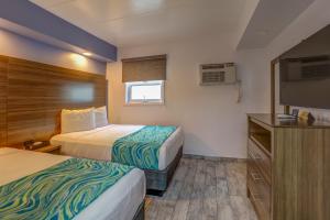 Efficiency Suite with One Full, One Twin Bed with Kitchenette Smoke Free room in Le Voyageur - a Red Collection Hotel