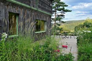 Maisons de vacances Chalet pour 2 dans le Jardin de Berchigranges : photos des chambres