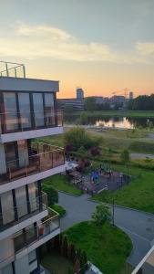 White and Bright Riverside View Flat with Parking, Bike Access, and Onsite Gym