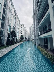 Olympus city garden condominium 1st floor with direct access from balcony to swimming pool