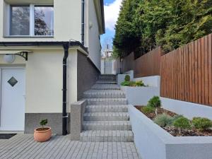 Apartmánový dům se zahradou v klidné části Prahy