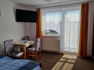 Pokoje I Apartamenty