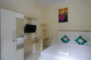Teratai Guesthouse Mitra RedDoorz near Tugu Yogyakarta - 科贾扬