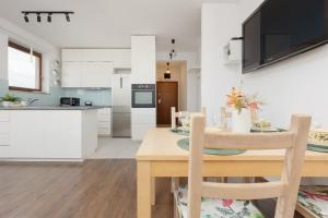 Spacious Family Apartment with Parking & Balcony in Warsaw, Bielany by Renters